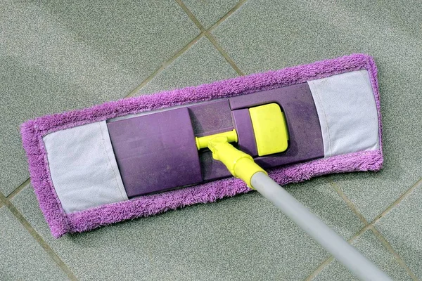 One Purple Cloth Mop Cleans Gray Stone Floor Dust Dirt — ストック写真