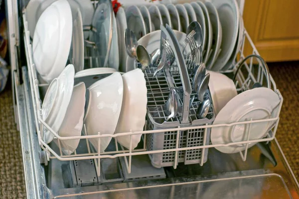 Set Kitchen Utensils Made White Plates Metal Spoons Forks Dishwasher — Stock Photo, Image