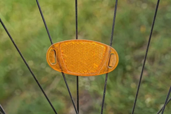 One Orange Plastic Reflector Black Metal Spokes Bicycle Wheel Outdoors — Photo