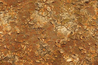 Eski paslı bir demir duvarın kırmızı kahverengi metal dokusu.