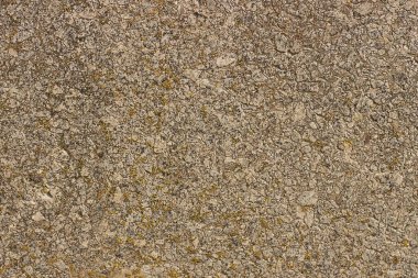 Mermer duvarın bir kısmından gri kahverengi taş dokusu