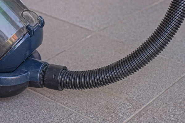 Long Black Plastic Hose Blue Vacuum Cleaner Stands Gray Concrete — Stock Photo, Image