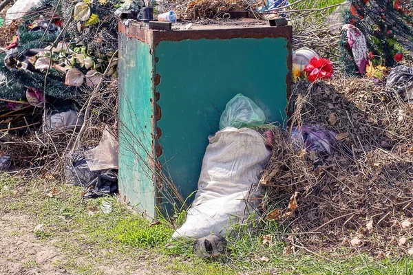 Pile Rubbish Overturned Metallic Green Trash Can Full White Bag — Zdjęcie stockowe