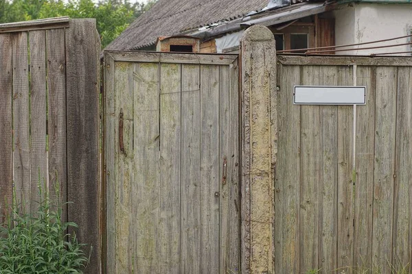 Old Gray Rural Wooden Wall Fence Closed Door Street Green — Stock Photo, Image