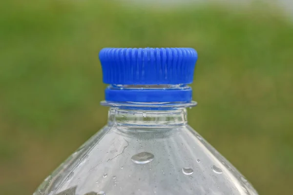 Part One Plastic Wet Bottle Closed Blue Cork Green Background — Stock Photo, Image