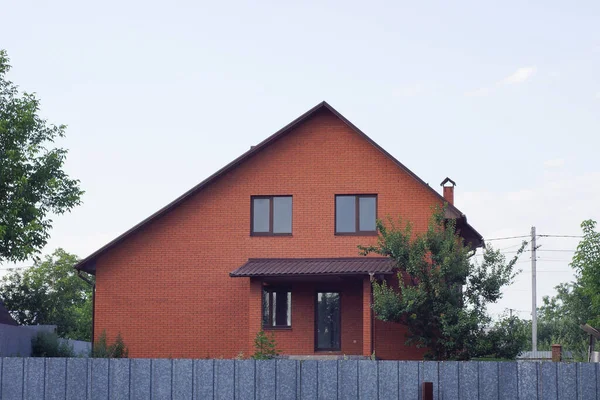 One Facade Red Private Brick House Street Gray Fence Blue — стоковое фото