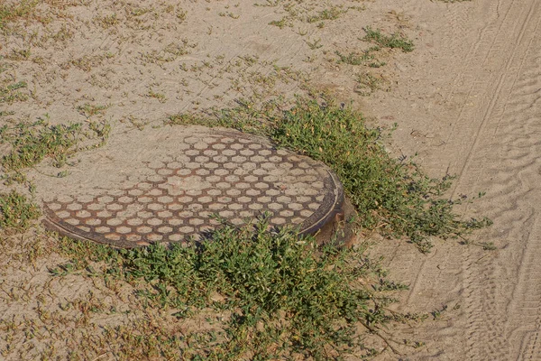 One Brown Iron Sewer Hatch Lies Gray Ground Green Grass —  Fotos de Stock