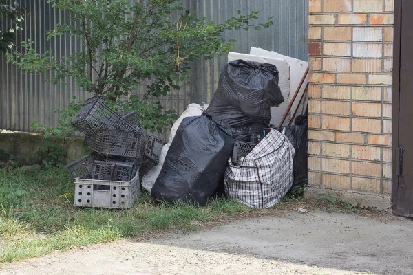 Black White Garbage Bags Plastic Box Pile Street Fence Wall — Stock Photo, Image