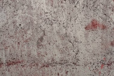 gray dirty stone texture from dirty concrete wall in the street with red spots