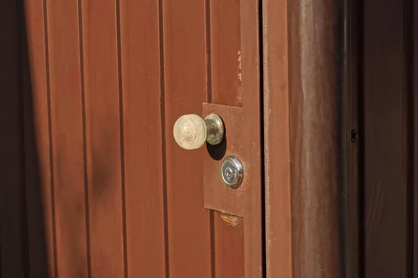 One White Plastic Doorknob Brown Metal Door Street — 스톡 사진