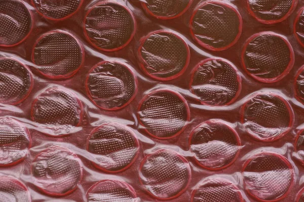 Red Plastic Texture Old Crumpled Cellophane Package Pimples — Fotografia de Stock