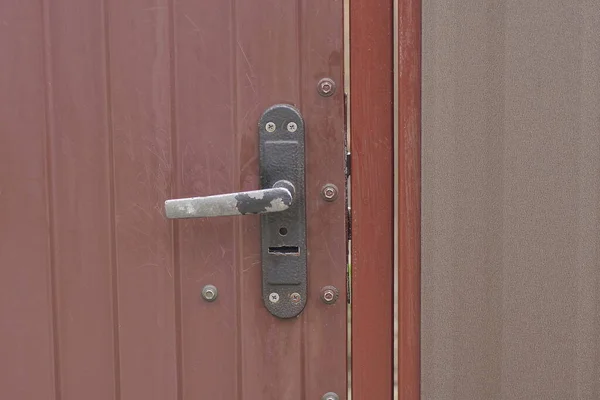 One Old Gray Iron Doorknob Brown Metal Door Street — Fotografia de Stock
