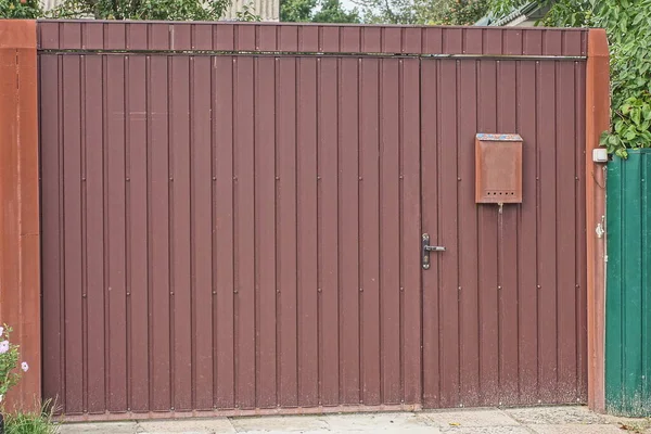 One Closed Brown Metal Door Part Wall Fence Street — Stock fotografie