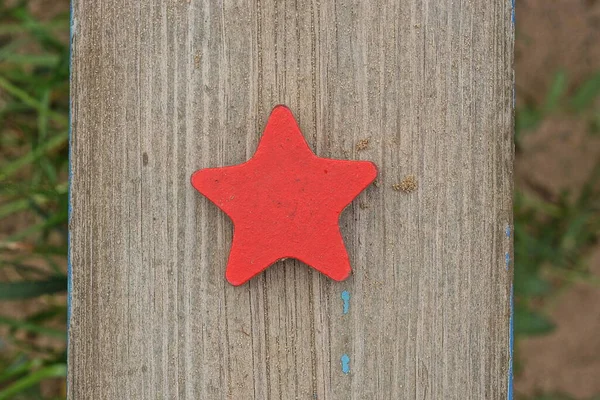 One Red Wooden Toy Star Lies Gray Sandbox Board Playground — Foto de Stock