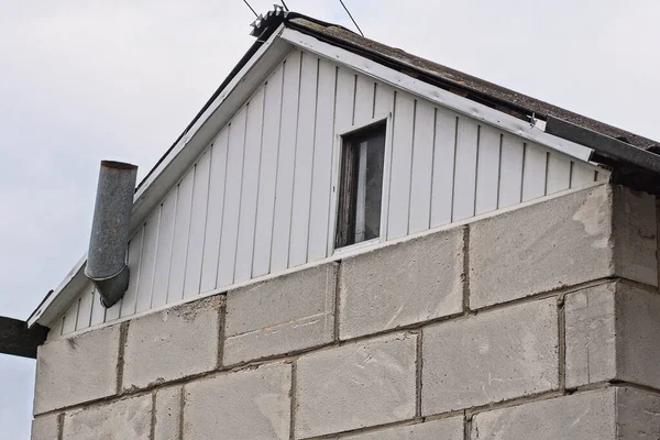 White Plastic Attic One Window Gray Brick Wall Private House — Stok fotoğraf