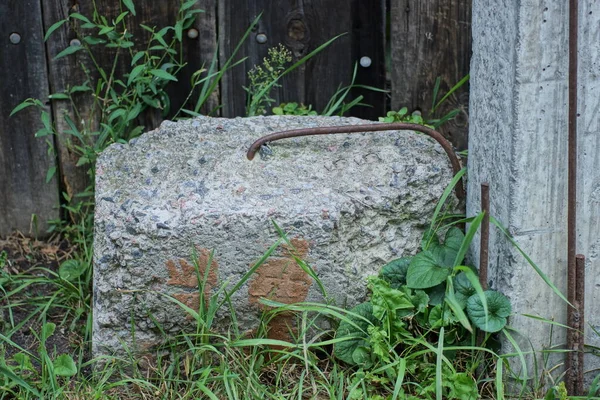 One Gray Concrete Piece Lies Ground Green Grass Street — Stok fotoğraf