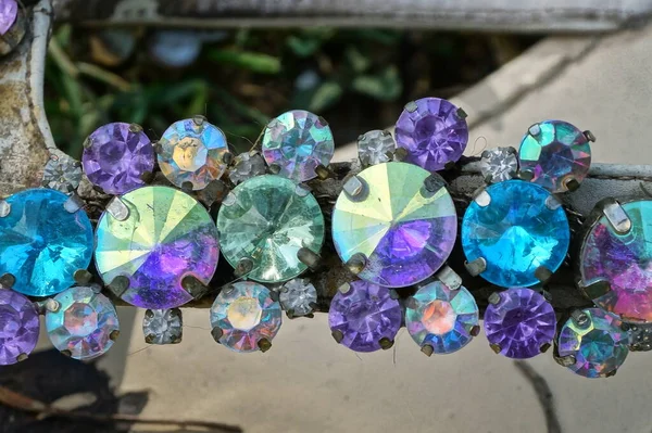 part of a bracelet with small colored round stones embellishments