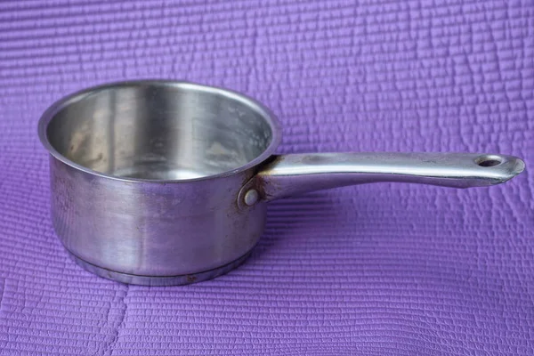 One Gray Open Metal Saucepan Long Handle Stands Purple Table — Stock Photo, Image