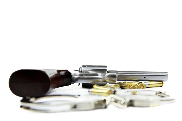 Gun, bullets and handcuffs isolated on white background — Stock Photo, Image