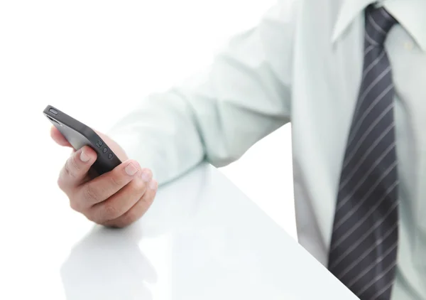 Businessman using phone on the desk — Stock Photo, Image