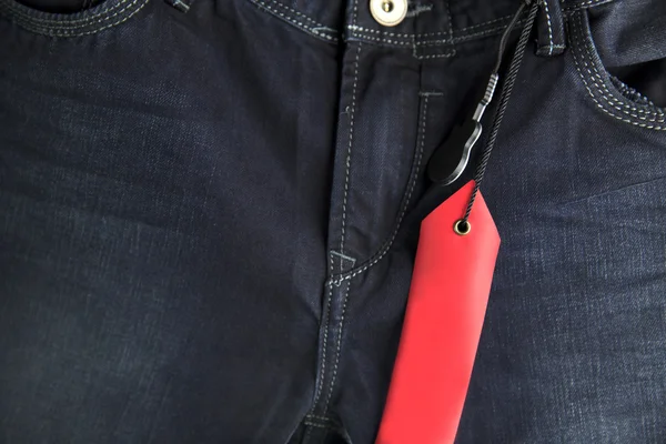 Prázdné červené látky džíny popisek — Stock fotografie