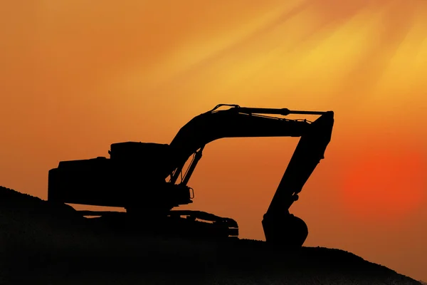 Silhouetted Digging Machine — Stock Photo, Image
