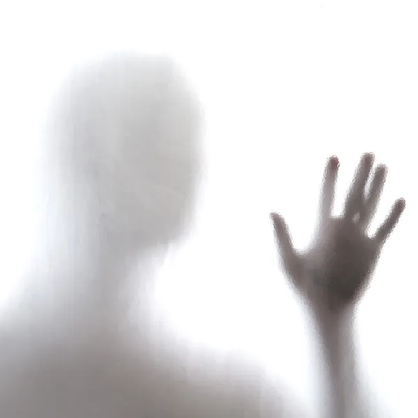 Man standing behind frosted glass — Stock Photo, Image