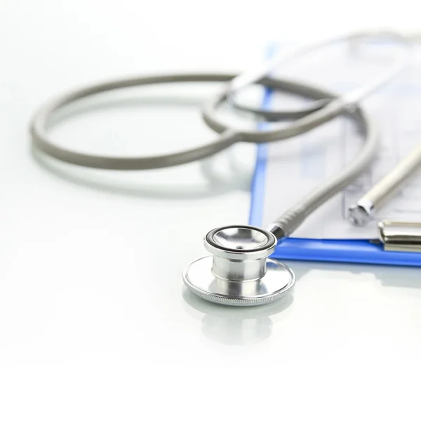 Stethoscope with blue medical clipboard — Stock Photo, Image