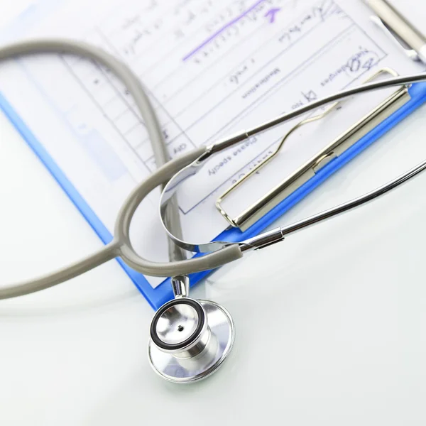 Stethoscope with blue medical clipboard — Stock Photo, Image