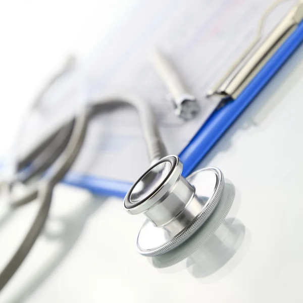 Stethoscope with blue medical clipboard — Stock Photo, Image