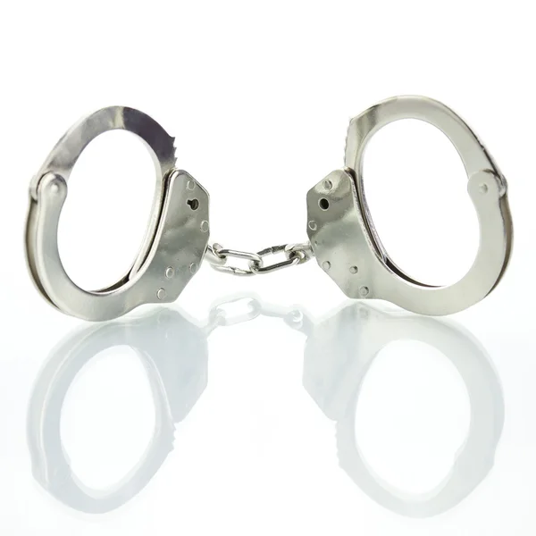 Handcuffs with shadow — Stock Photo, Image