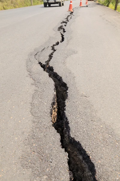 Cracked asphalt road — Stock Photo, Image