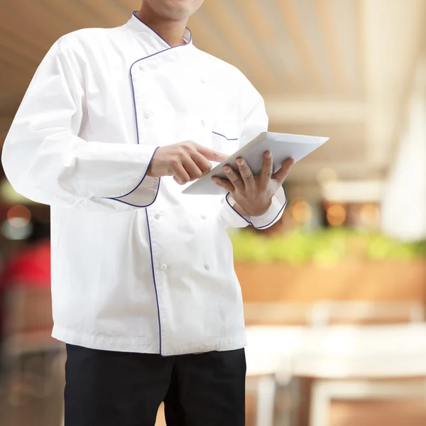 Chef using digital tablet — Stock Photo, Image