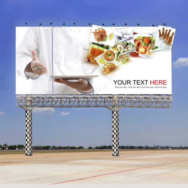 Chef using digital tablet on outdoor billboard — Stock Photo, Image