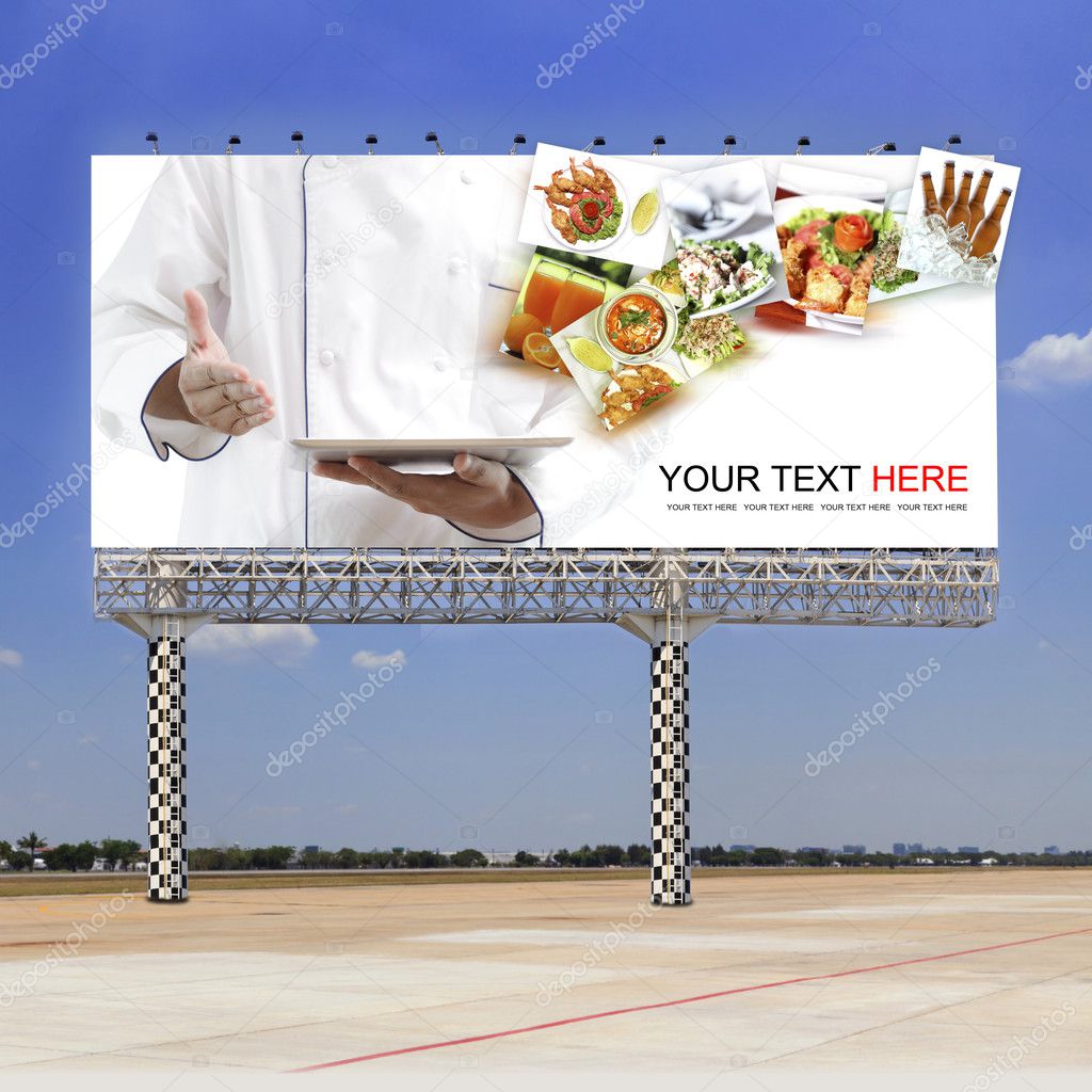 Chef using digital tablet on outdoor billboard