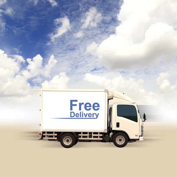 White van with Free delivery and blue sky — Stock Photo, Image