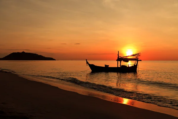 Silhouette of fishing boat at sunset Royalty Free Stock Images