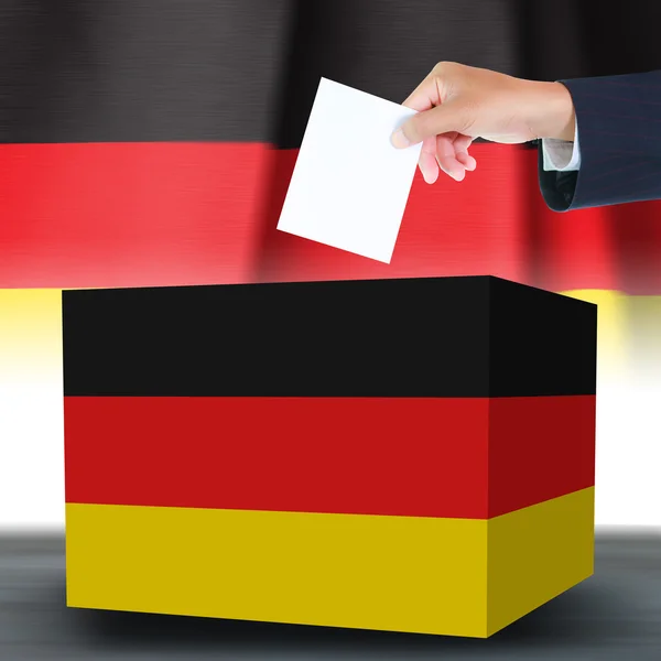 깃발의 독일에 있는 ballotand 상자와 손 — 스톡 사진