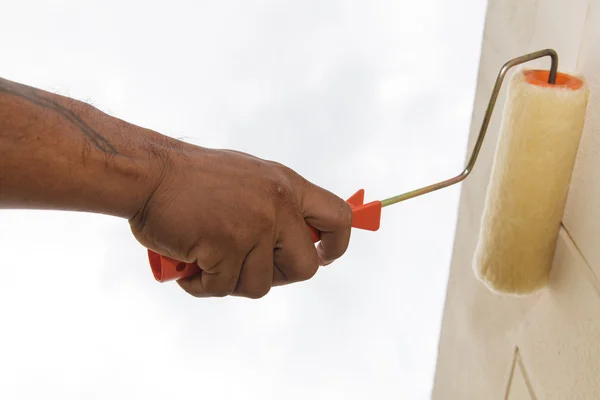 Painting with roller on wall — Stock Photo, Image