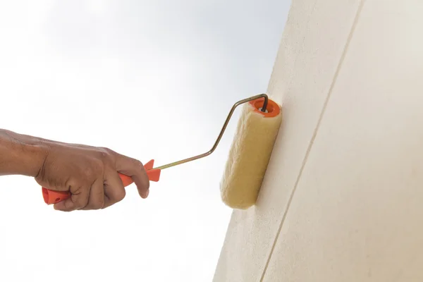 Painting with roller on wall — Stock Photo, Image