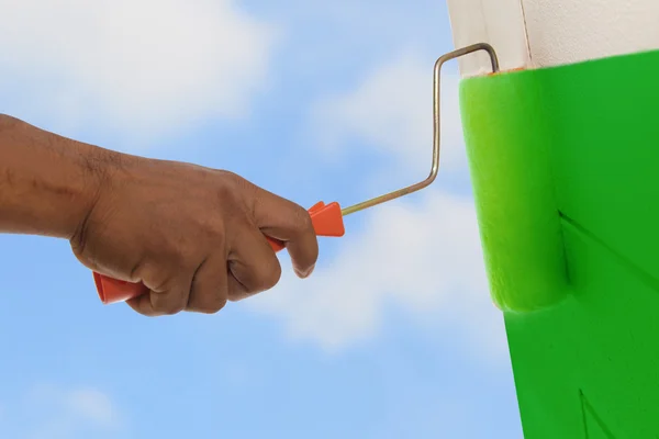 Green color painting wall with roller — Stock Photo, Image