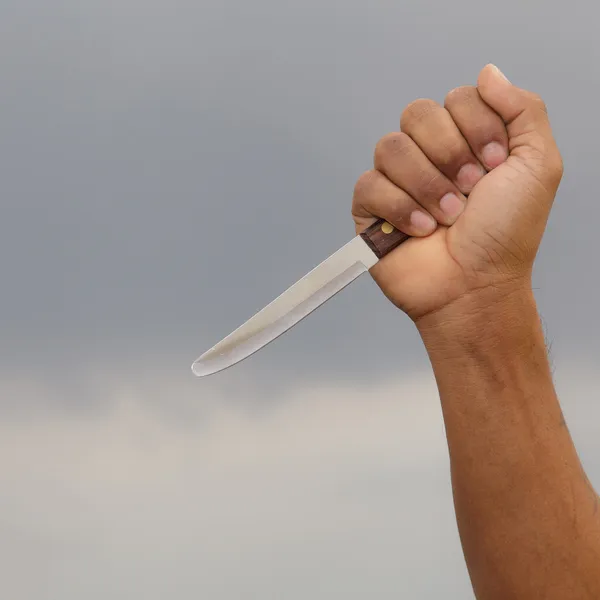 Knife in a hand — Stock Photo, Image