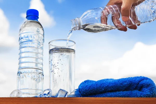 Glass of water and bottle — Stock Photo, Image