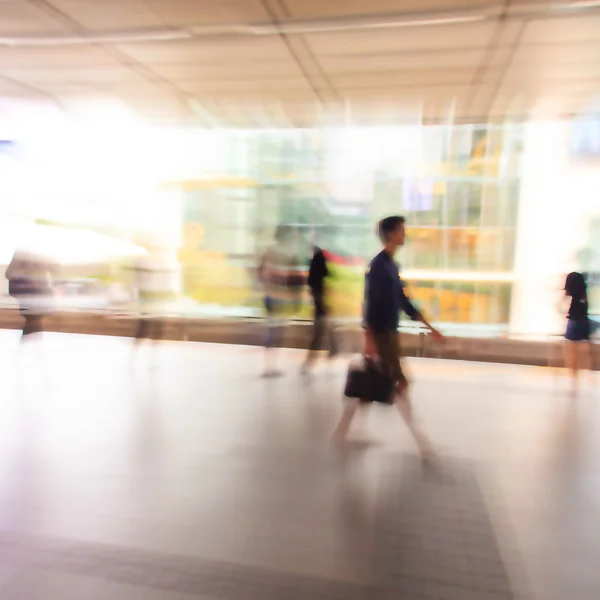 City people walking in skytrain station in motion blur — Stock Photo, Image