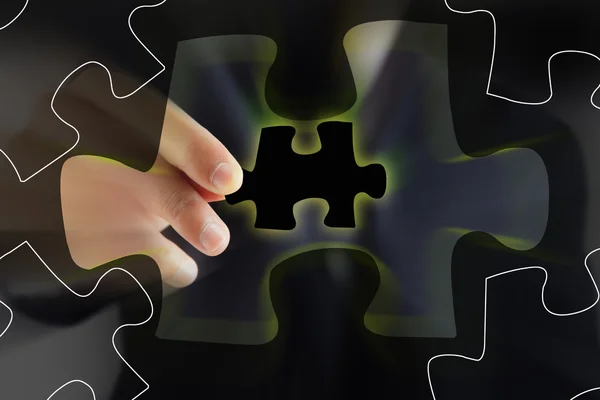 Businessman showing puzzle — Stock Photo, Image