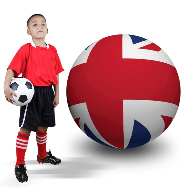 Child soccer player with United Kingdom ball — Stock Photo, Image