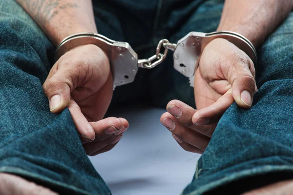 Prisoner locked in handcuffs — Stock Photo, Image