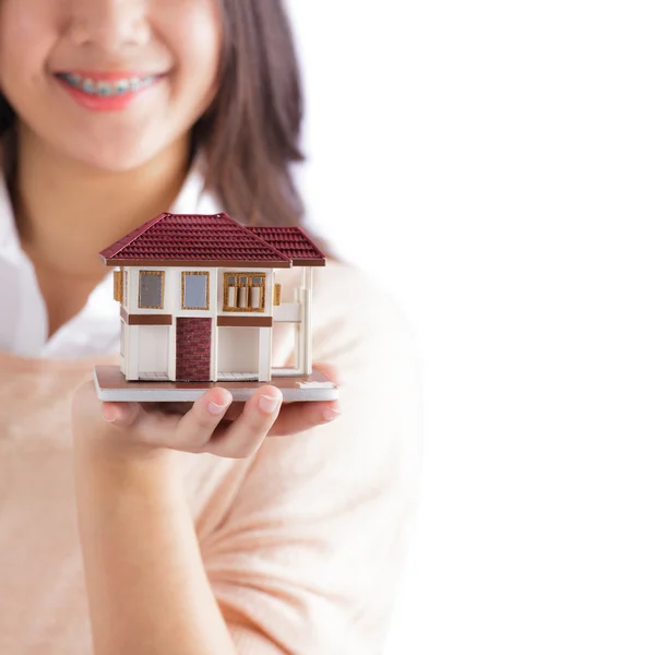 Woman holding little house — Stock Photo, Image