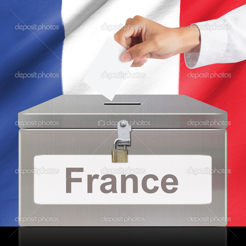 Hand with ballot and metal box