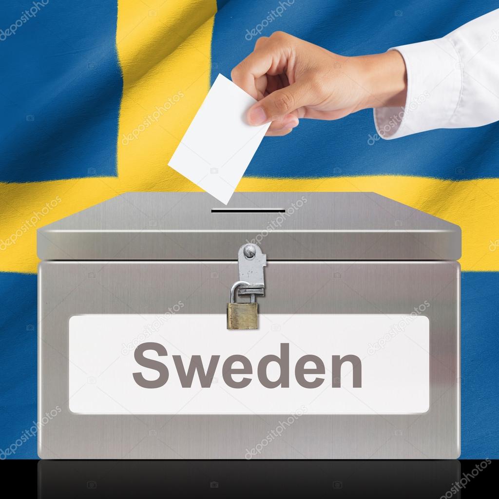 Hand with ballot and metal box